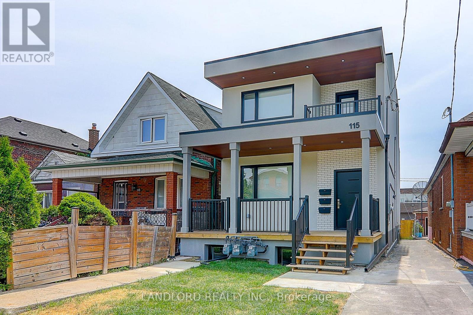 A two-story house with a balcony on the second floor is for sale.