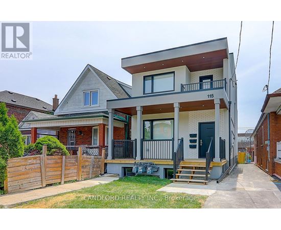 A two-story house with a balcony on the second floor is for sale.