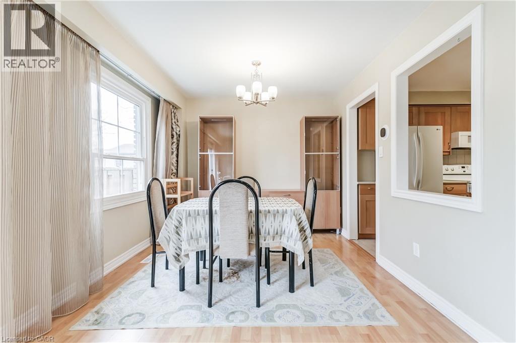 A dining room with a table set for four.