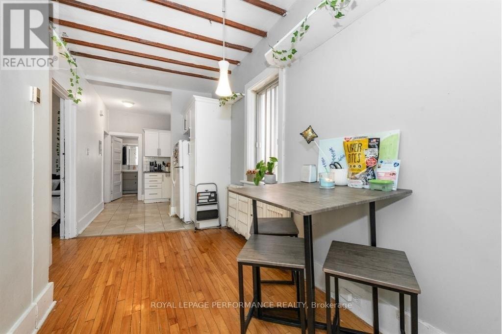 A kitchen with a table and chairs in the middle of the room.