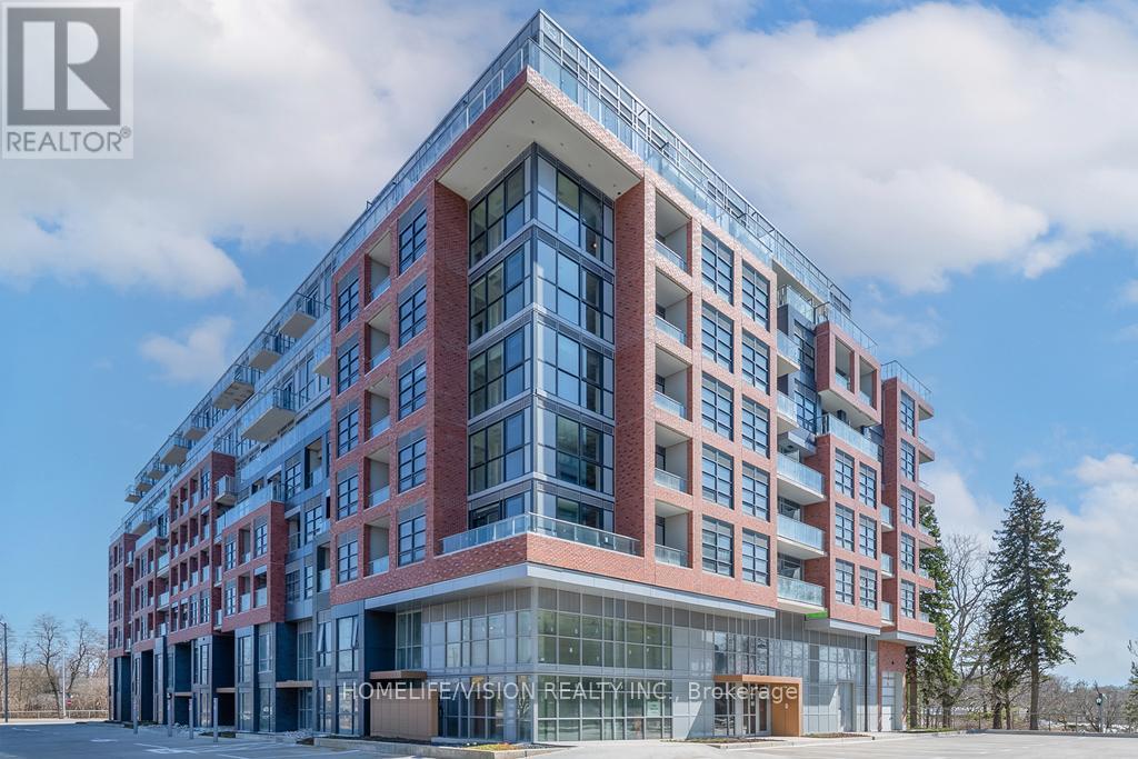 A modern multi-story building with a glass entrance and a sign that reads "HOMELIFE VISION REALTORS".