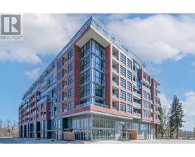 A modern multi-story building with a glass entrance and a sign that reads "HOMELIFE VISION REALTORS".