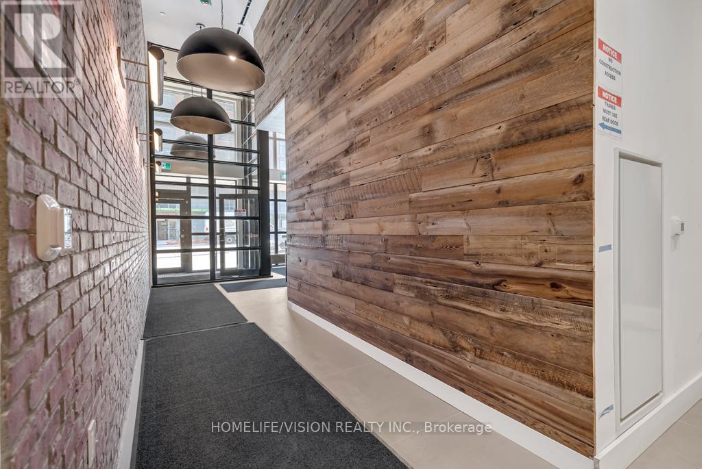 A hallway with a wooden wall and a brick wall on the side.