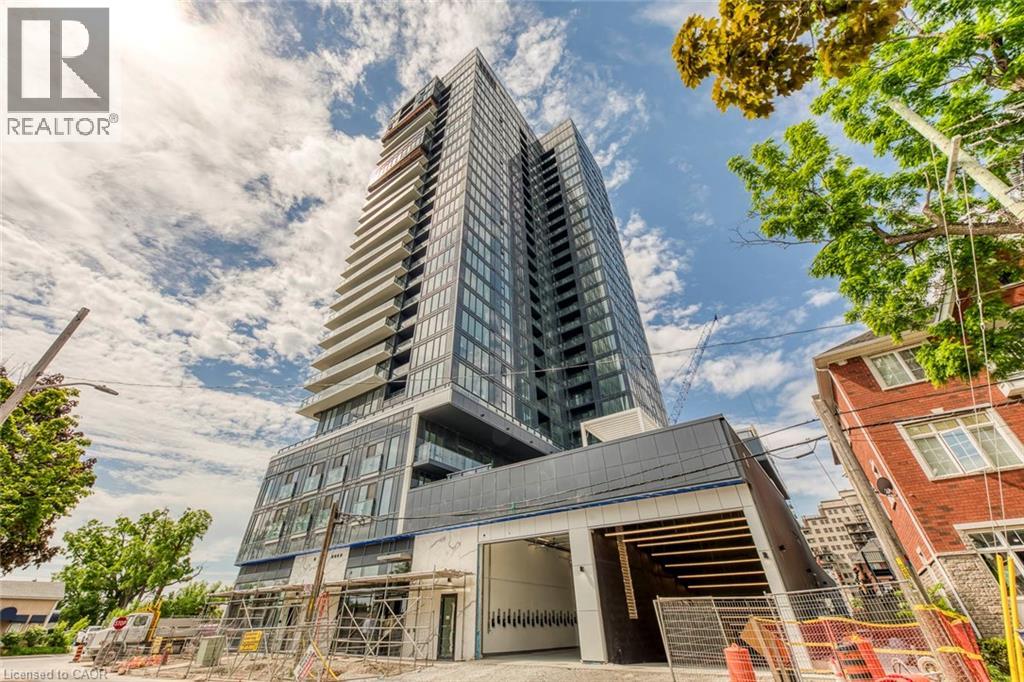 A modern multi-story building under construction with a clear sky in the background.