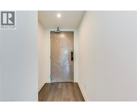 A room with a door covered in plastic wrap.