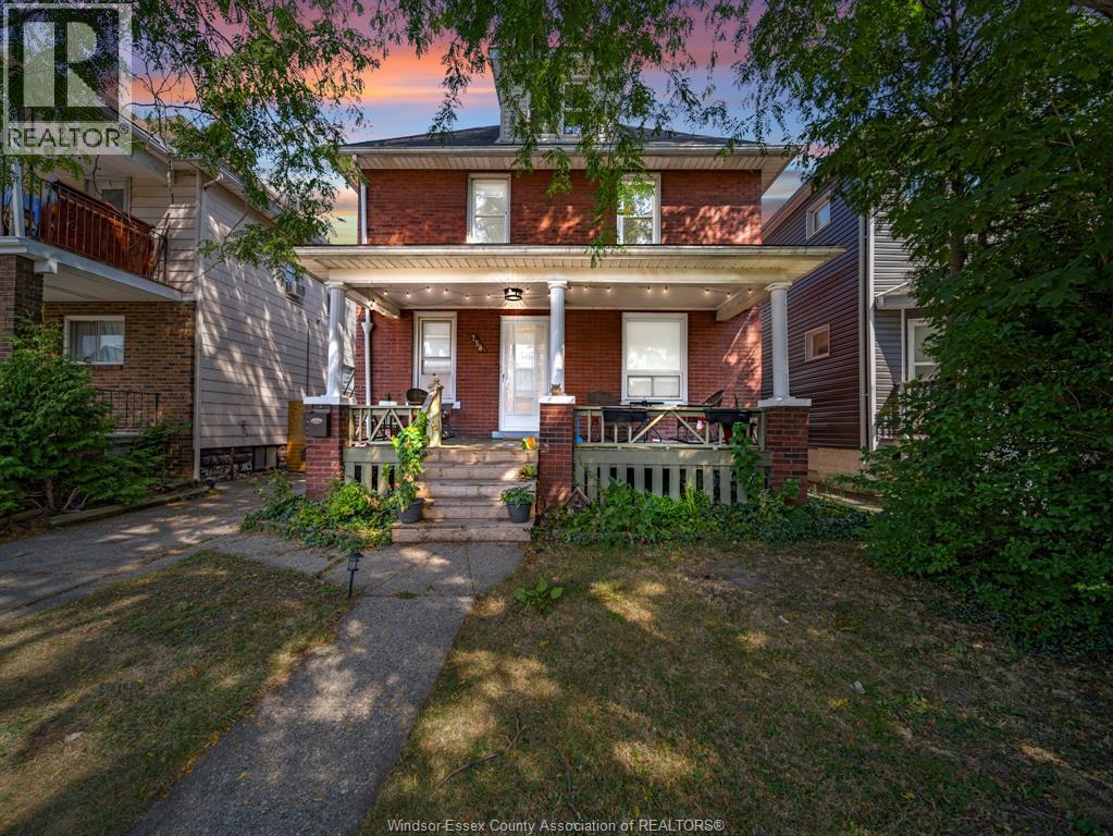 A house with a lawn in front of it.