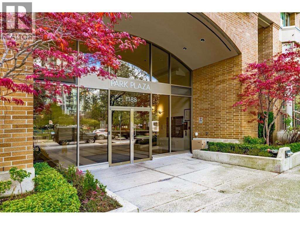 The entrance to Park Plaza with a tree with red leaves on the left.