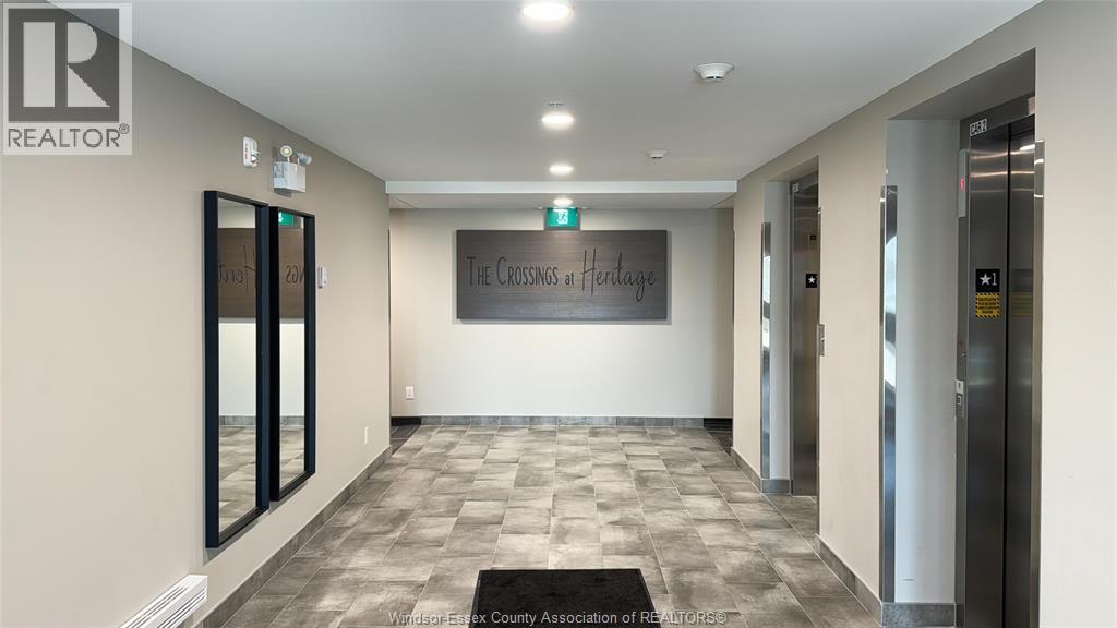 A hallway with a sign that says "The Crossing at Heritage".