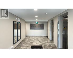 A hallway with a sign that says "The Crossing at Heritage".