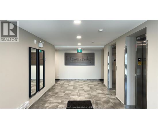 A hallway with a sign that says "The Crossing at Heritage".