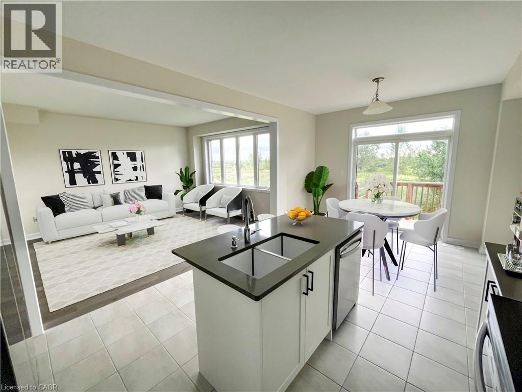 A modern kitchen with a dining table and chairs.