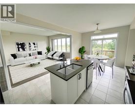A modern kitchen with a dining table and chairs.