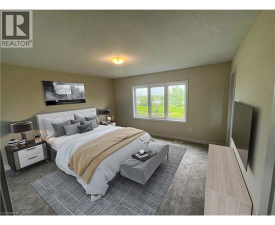 A bedroom with a large bed and a flat screen TV mounted on the wall.