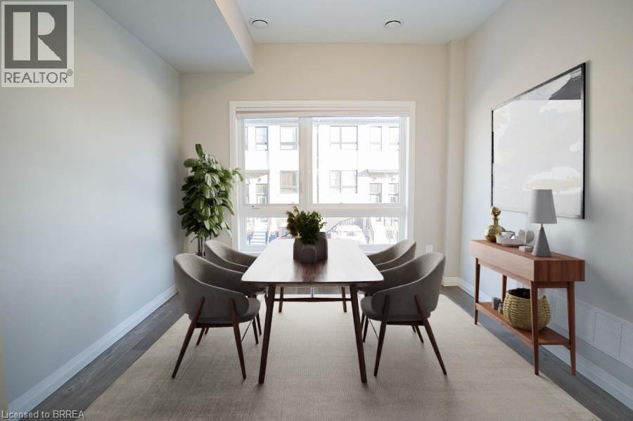 A dining room with a table and chairs.