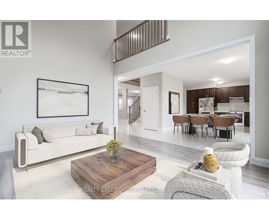 A living room with a white couch and a wooden coffee table.
