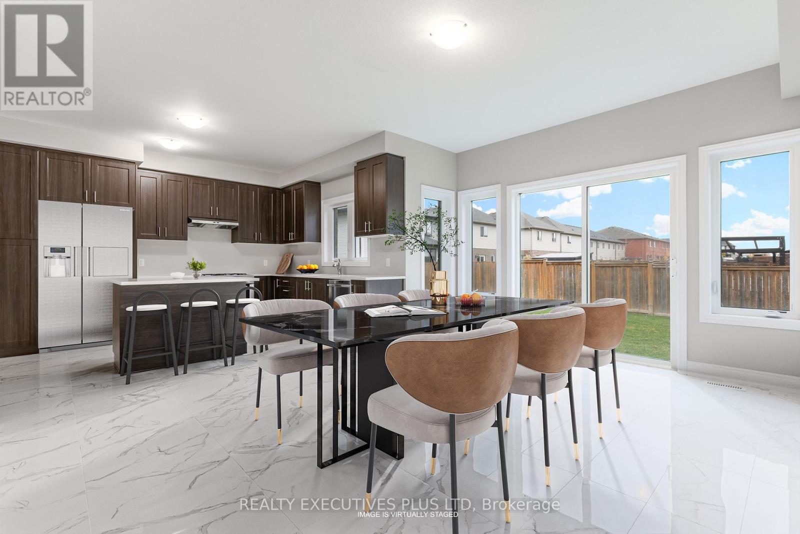 A modern kitchen with a dining table set for four.