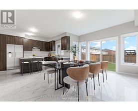 A modern kitchen with a dining table set for four.