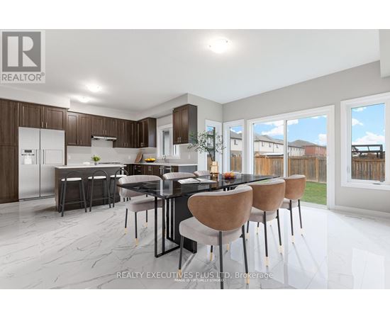 A modern kitchen with a dining table set for four.