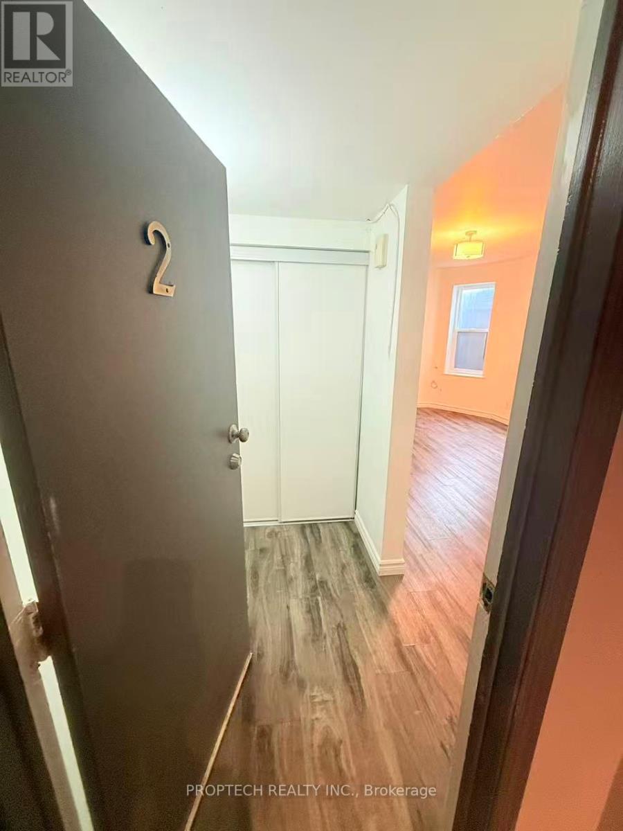 A hallway with a door numbered 2.
