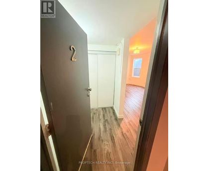 A hallway with a door numbered 2.
