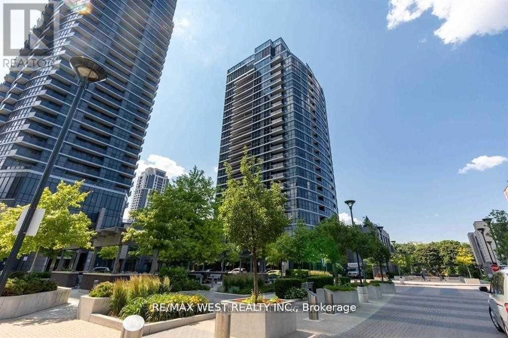 A brokerage photo of a REMAX West building in a city setting.