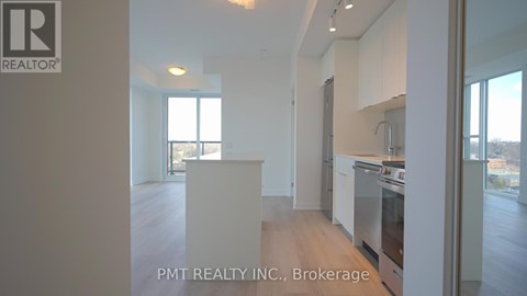 A real estate listing photo of a kitchen with a sink and stove.