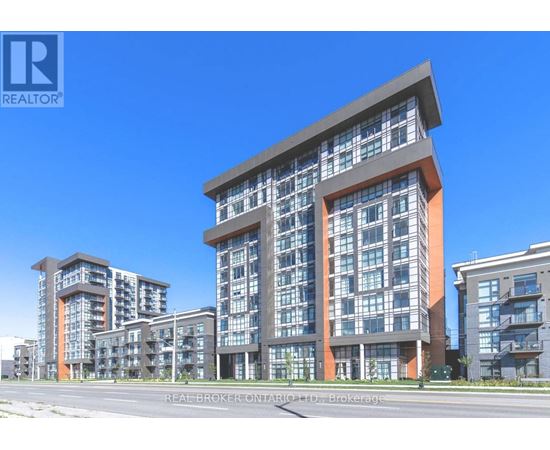 A modern multi-story residential building with a clear blue sky in the background.