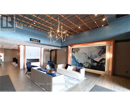 A living room with a large painting on the wall and a sign that says "Trend 2".
