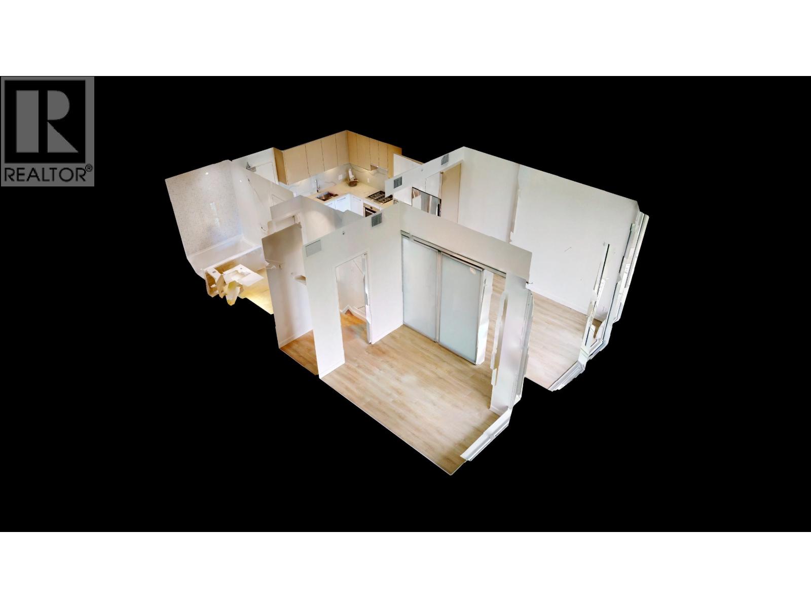 A top down view of a white interior space with a wooden floor and a large window.