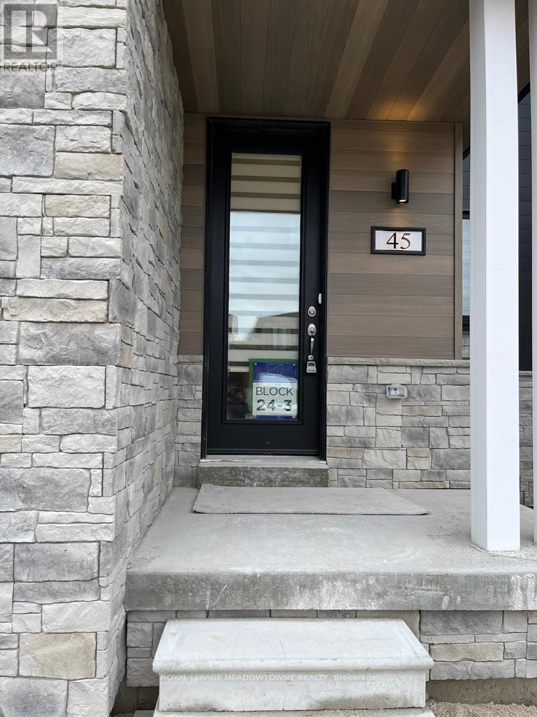 A black door with a glass window and a sign that says Block 24-3.