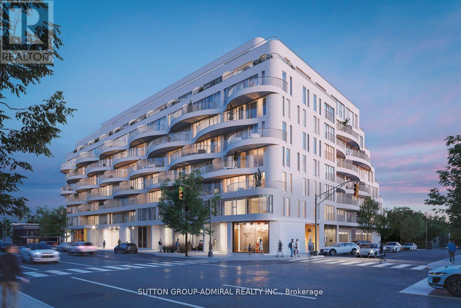 A modern white building with balconies and multiple stories is depicted in the image.