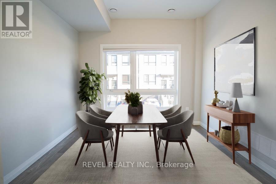 A dining room with a table set for four.