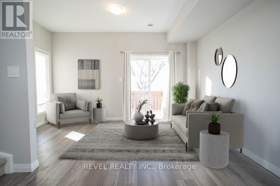 A living room with a grey sofa, a grey armchair, a grey rug, a grey coffee table, a grey plant, a grey wall, a grey door, a grey window, a grey picture frame, a grey cushion