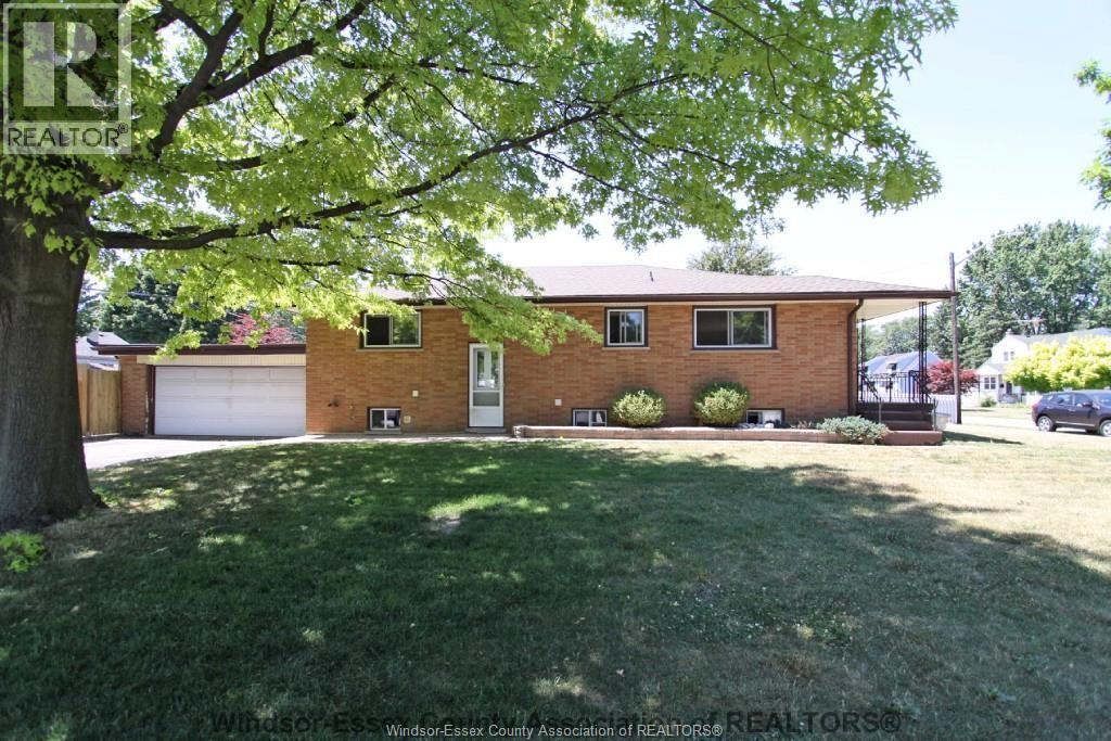 A house with a lawn in front of it.