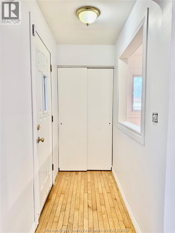 A white door with a window above it.