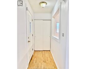 A white door with a window above it.