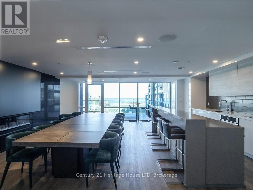 A modern dining room with a long table and chairs.
