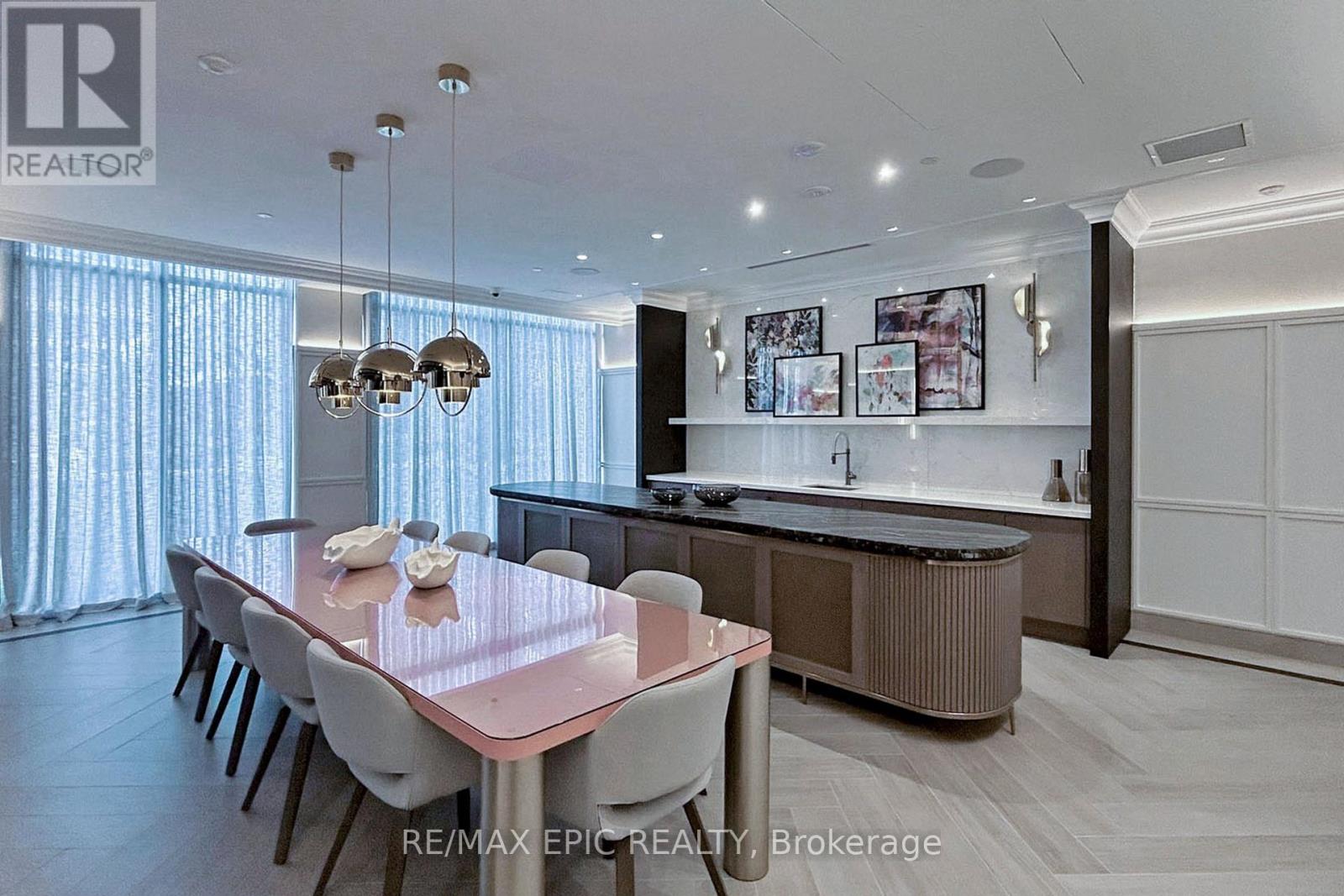 A modern dining room with a table set for four.