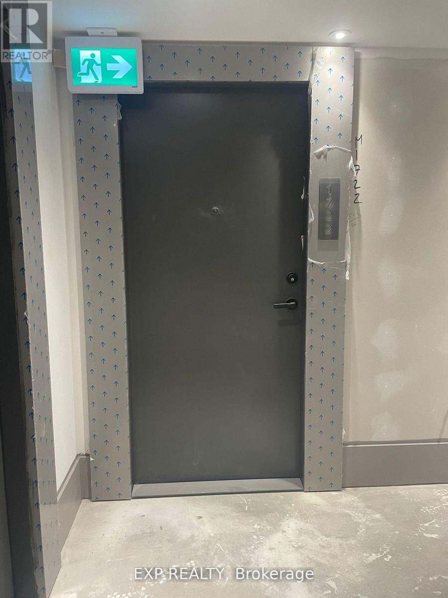 A black door with a sign above it that says "EXIT".