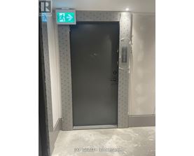 A black door with a sign above it that says "EXIT".