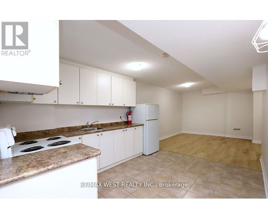 A kitchen with white cabinets and a countertop.