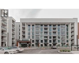 A large building with a sign that says REALTOR in front of it.