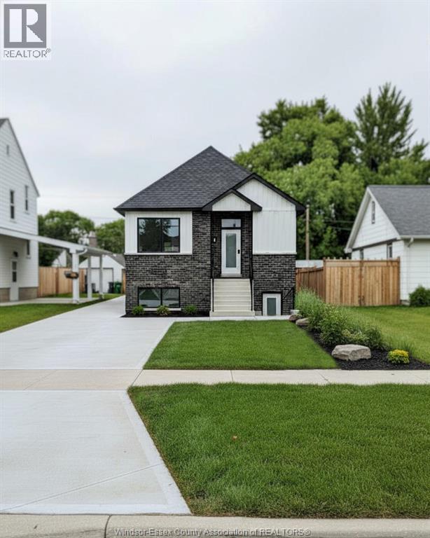 A house with a black front door and a small porch.