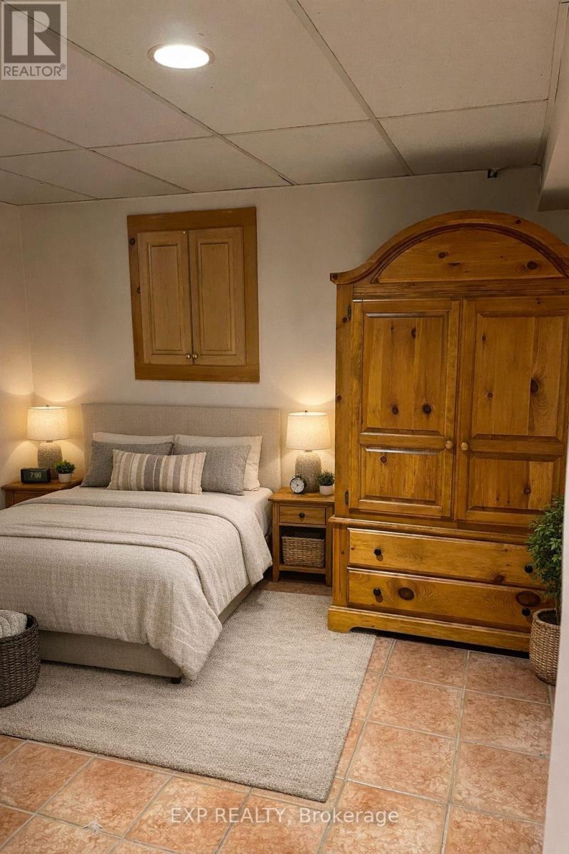 A bedroom with a bed, nightstand, and wardrobe.