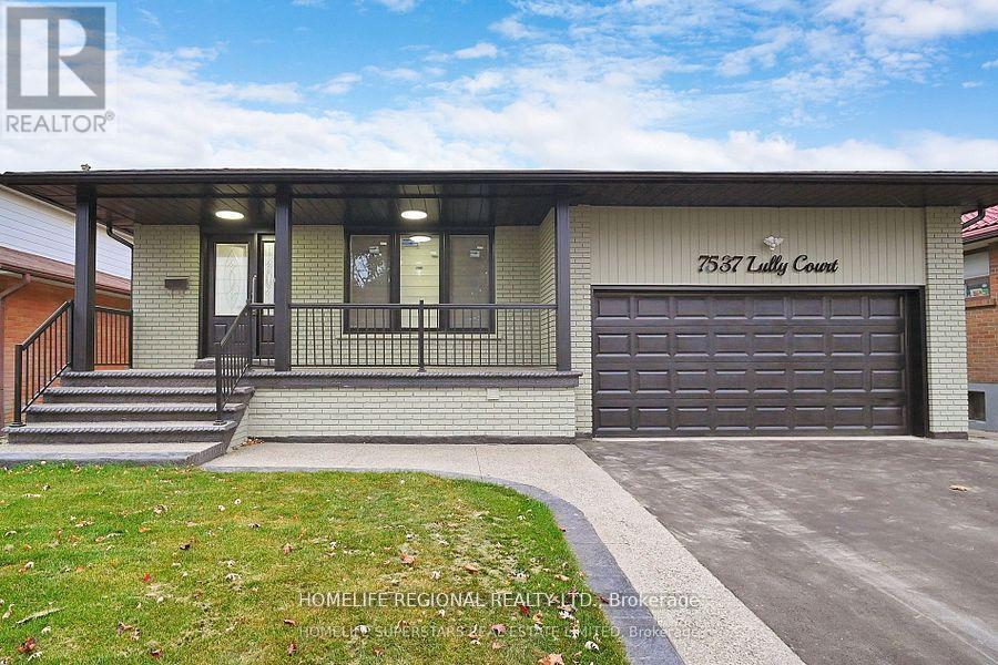 A house with a garage and a sign that says "7537 Lutty Court".