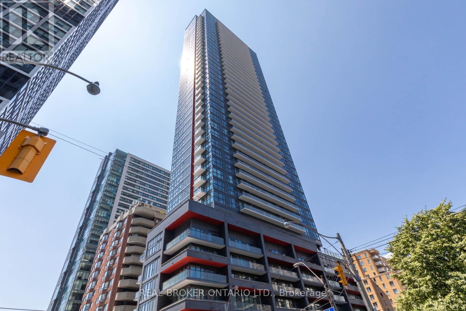A tall building with a blue sky in the background.