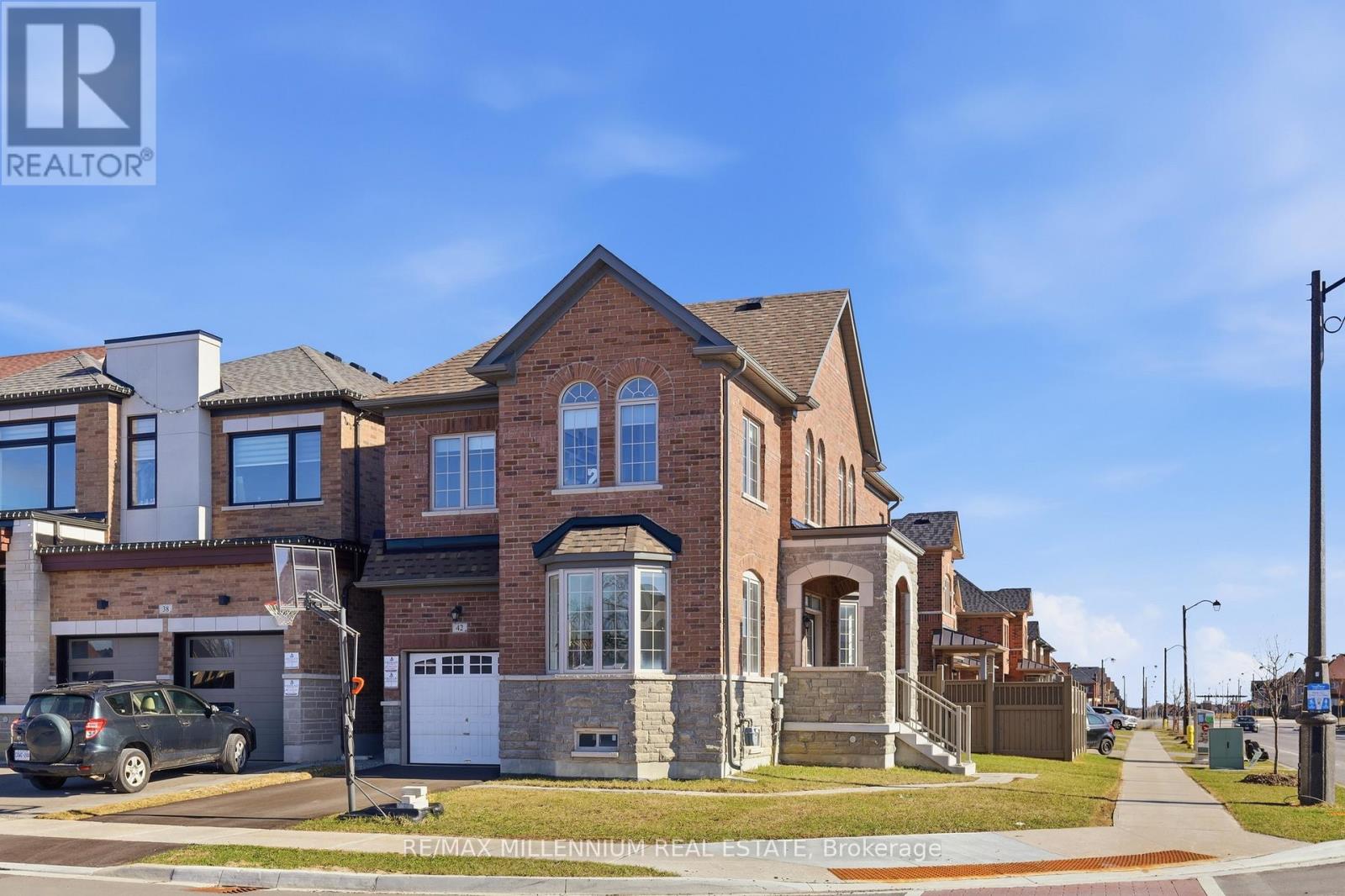A large brick house with a garage is for sale.