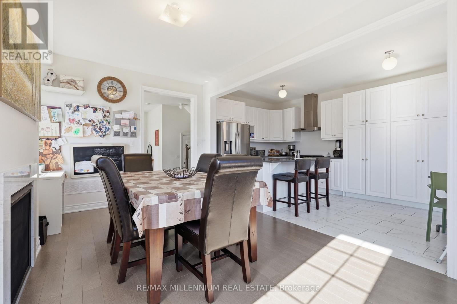 A dining room with a table set for four.