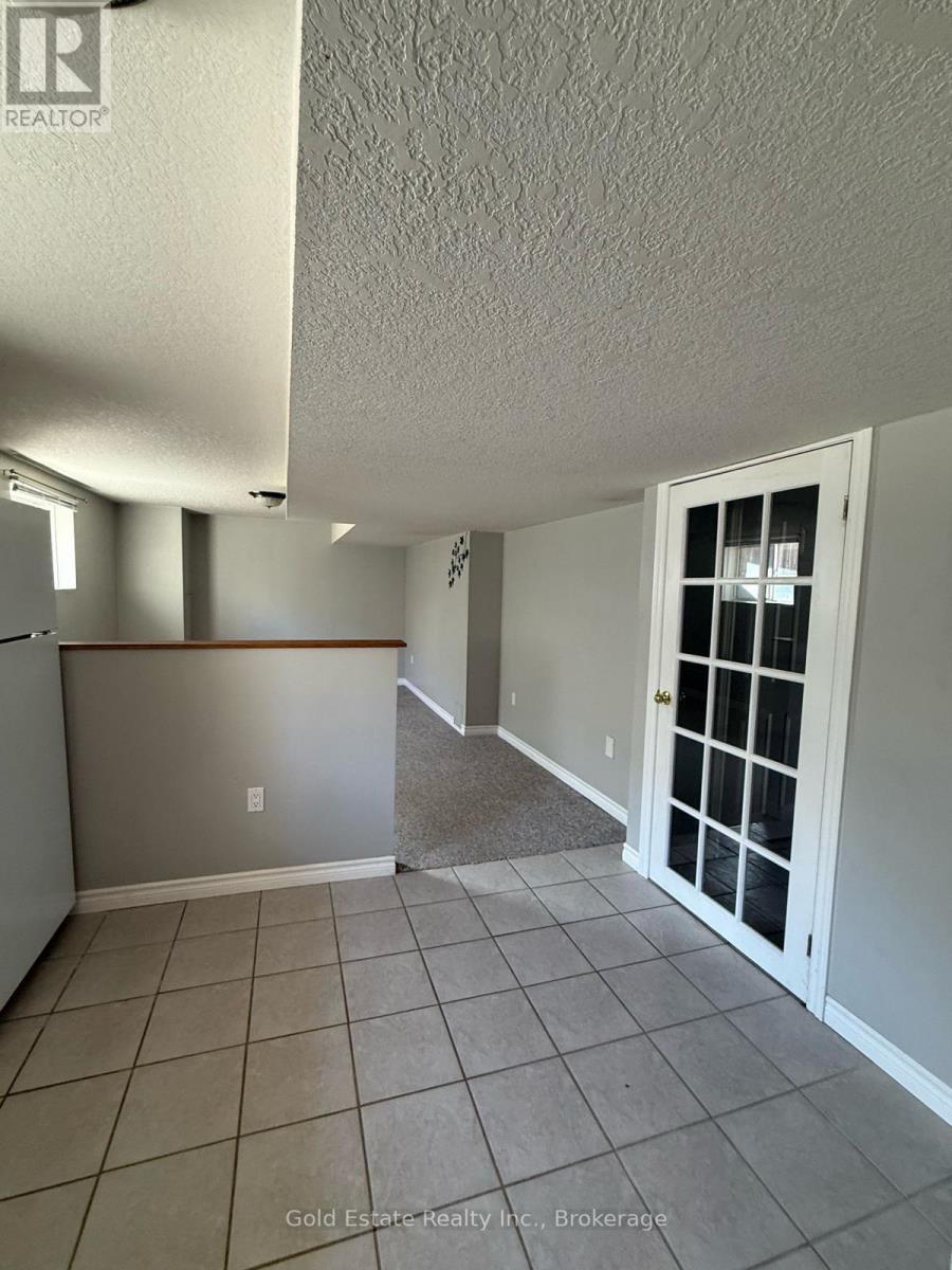 A room with a white door and a window.