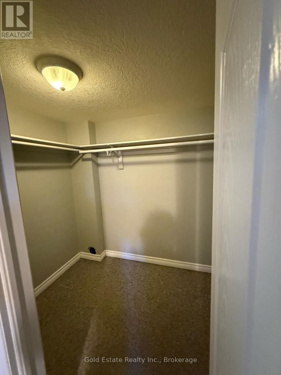 A brokerage image of a small, empty room with carpet flooring and white walls.